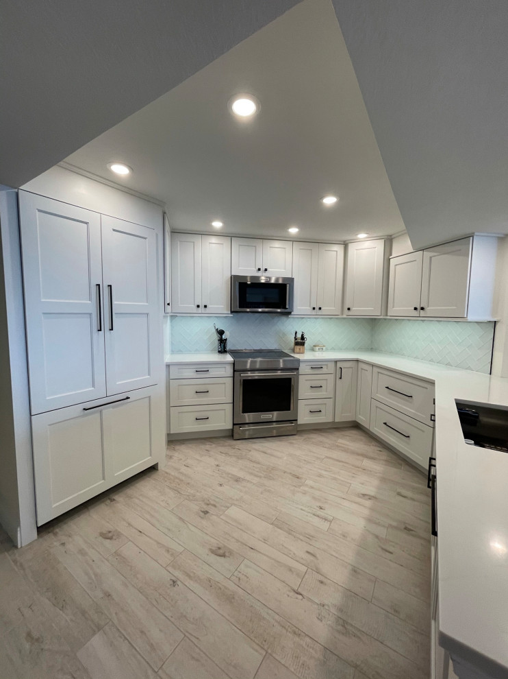 This is an example of a medium sized nautical kitchen in Miami.