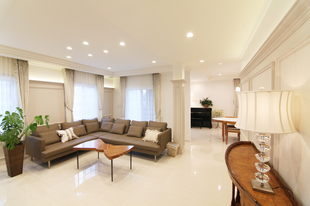 Photo of a large contemporary formal open concept living room in Kobe with beige walls, marble floors, no fireplace, a freestanding tv, beige floor, planked wall panelling and recessed.