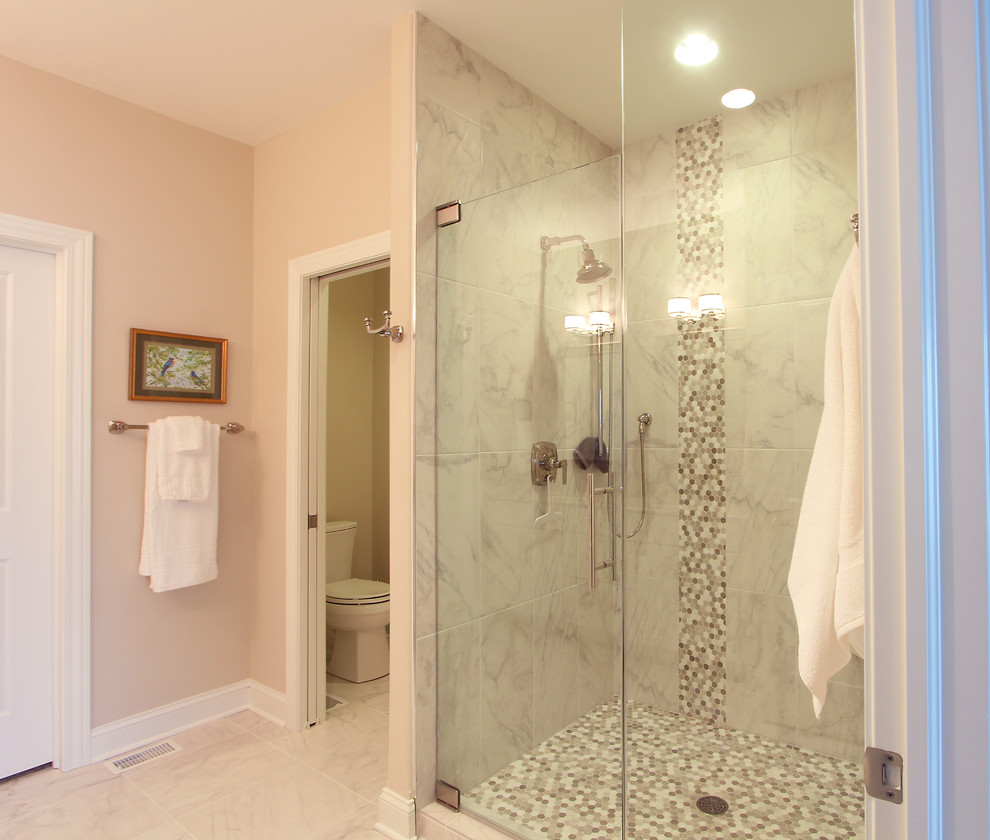 This is an example of a mid-sized traditional master bathroom in Other with recessed-panel cabinets, white cabinets, an alcove shower, a two-piece toilet, white tile, marble, beige walls, marble floors, an undermount sink, engineered quartz benchtops, white floor, a hinged shower door and beige benchtops.