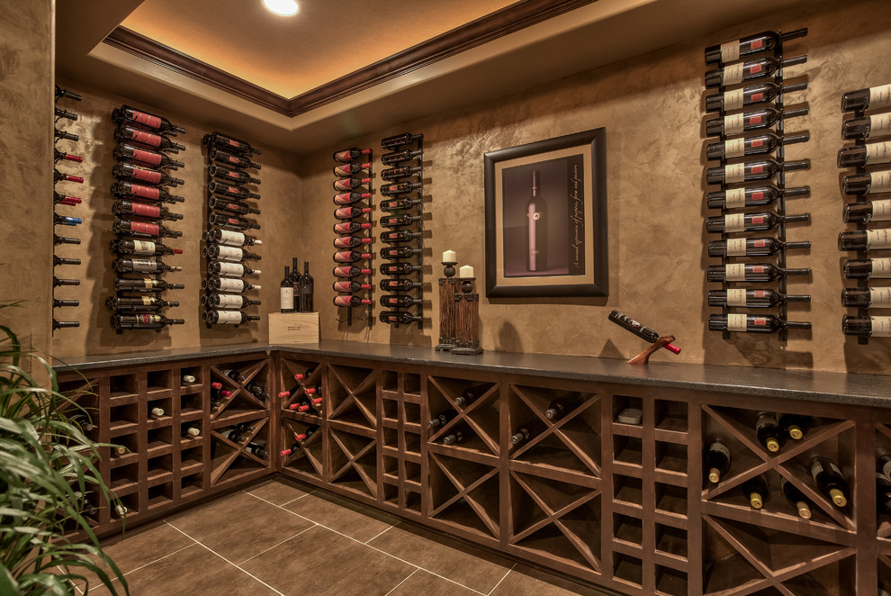 This is an example of a mid-sized arts and crafts wine cellar in Omaha with ceramic floors and diamond bins.