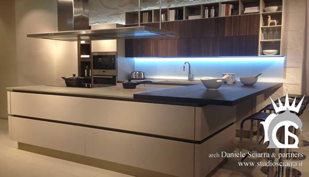 Photo of a large contemporary single-wall open plan kitchen in Rome with an integrated sink, marble worktops, an island and white worktops.