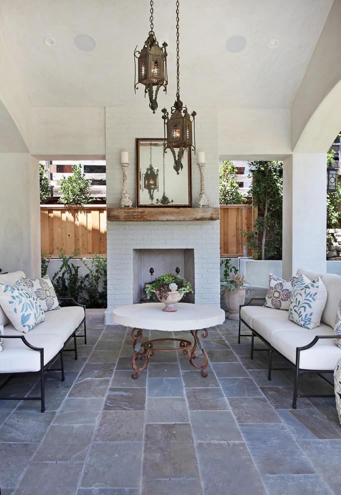 Inspiration for a mediterranean patio in Orange County with a fire feature.