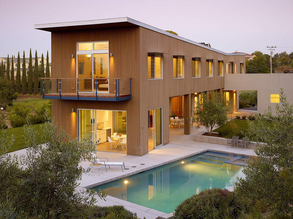 This is an example of a contemporary two-storey exterior in Los Angeles with wood siding.