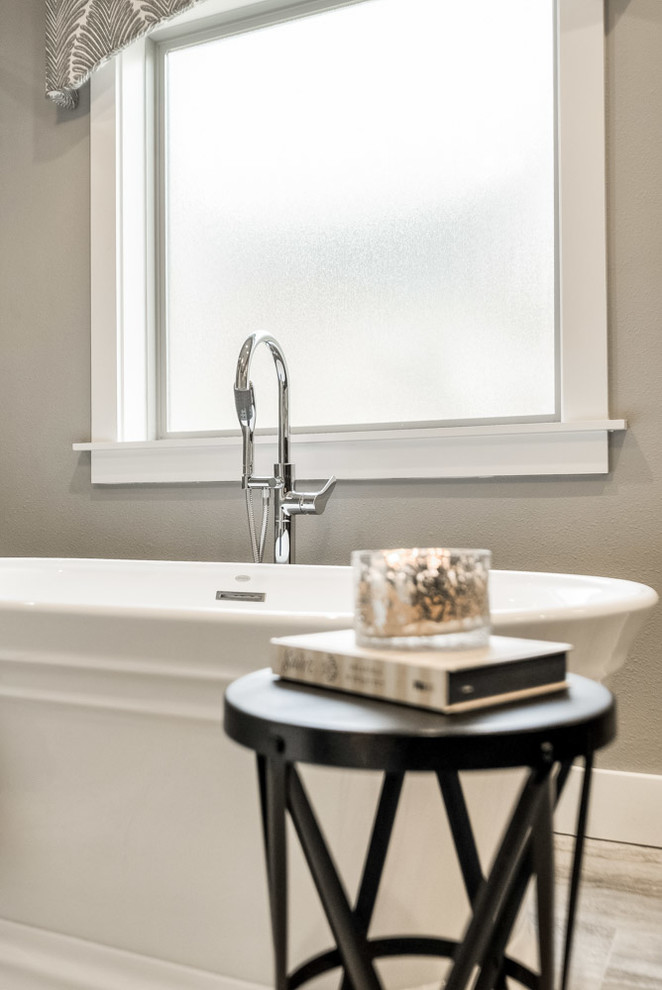Home design - mid-sized transitional master gray tile and porcelain tile ceramic tile and beige floor home design idea with recessed-panel cabinets, dark wood cabinets, a one-piece toilet, gray walls and quartz countertops