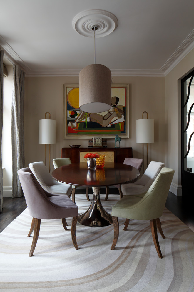 Inspiration for a transitional separate dining room in London with beige walls and carpet.