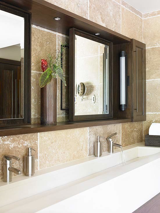 Photo of a contemporary bathroom in Los Angeles with a trough sink, raised-panel cabinets, dark wood cabinets, engineered quartz benchtops, a freestanding tub, a corner shower, a one-piece toilet, brown tile and stone tile.