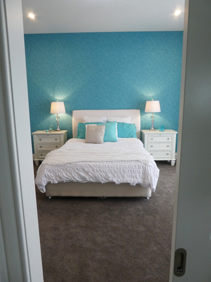 Design ideas for a large transitional bedroom in Melbourne with white walls and carpet.
