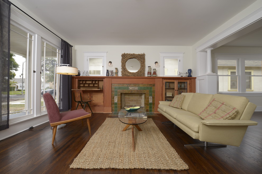 Photo of a mid-sized arts and crafts formal open concept living room in Los Angeles with no tv, white walls, dark hardwood floors, a standard fireplace and a tile fireplace surround.