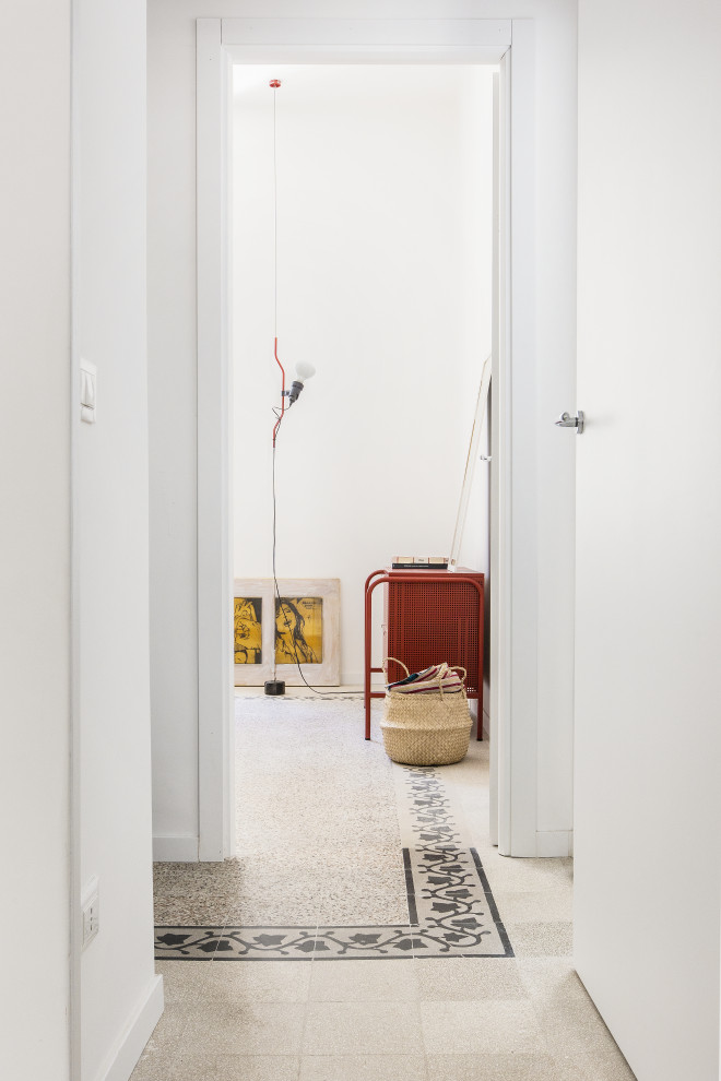 Inspiration for a mid-sized eclectic hallway in Rome with white walls, terrazzo floors and multi-coloured floor.