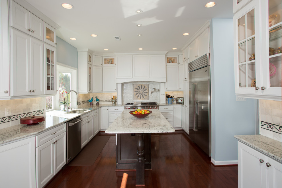 This is an example of a large traditional eat-in kitchen in DC Metro with a single-bowl sink, recessed-panel cabinets, white cabinets, granite benchtops, white splashback, stainless steel appliances, medium hardwood floors and with island.