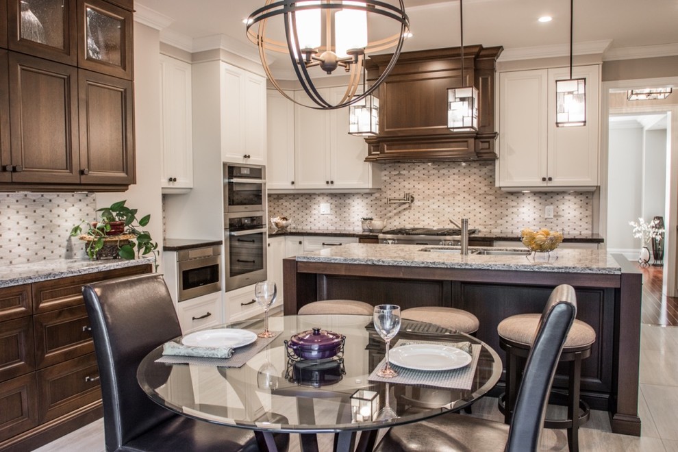 Mid-sized transitional l-shaped ceramic tile eat-in kitchen photo in Toronto with an undermount sink, shaker cabinets, granite countertops, mosaic tile backsplash, stainless steel appliances, an island, gray backsplash and white cabinets