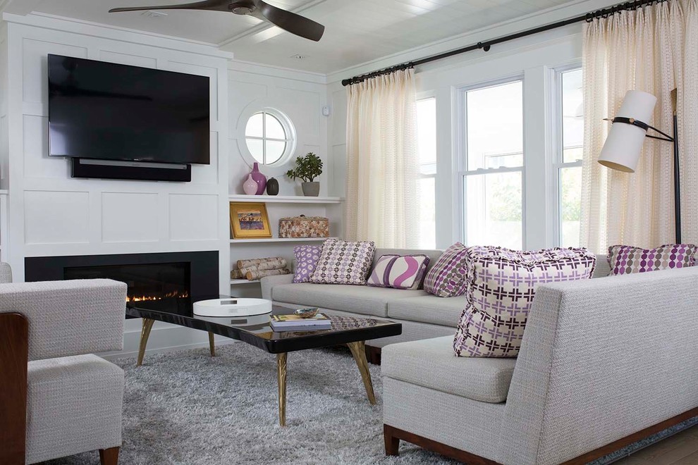 This is an example of a transitional living room in Other with white walls, a ribbon fireplace, a wall-mounted tv and brown floor.