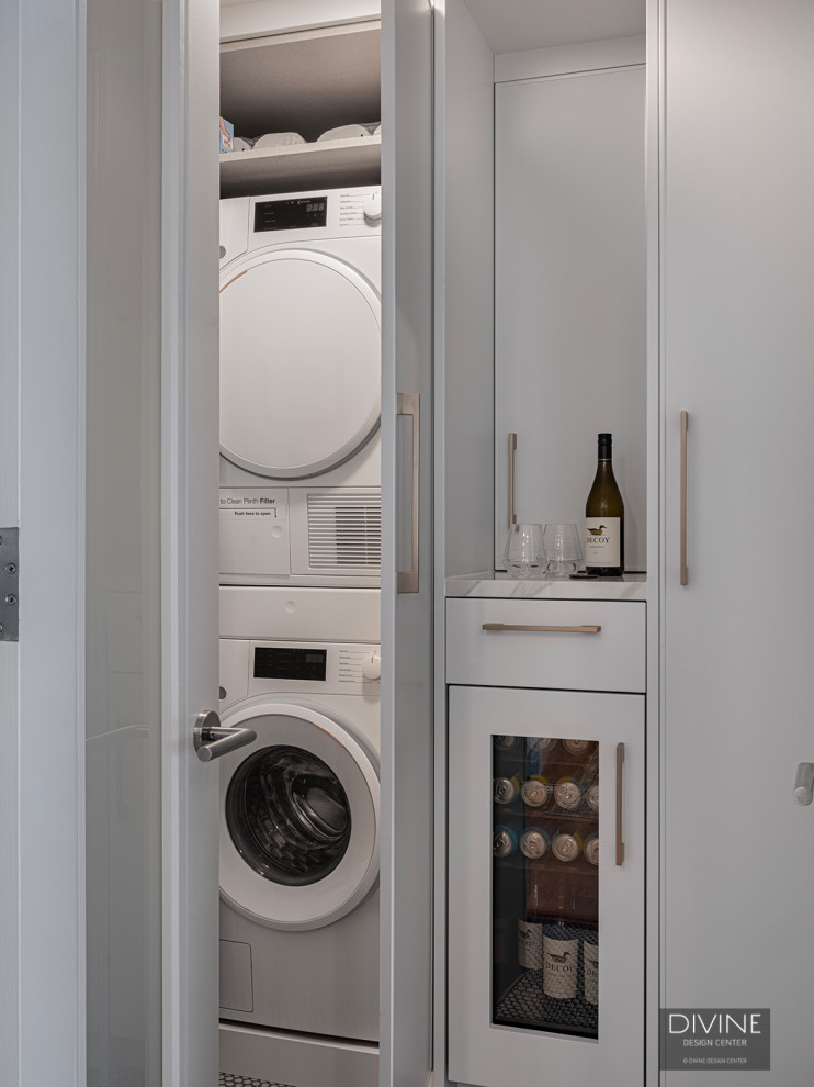 Kitchen pantry - mid-sized transitional medium tone wood floor and brown floor kitchen pantry idea in Boston with shaker cabinets, white cabinets, marble countertops, white backsplash, marble backsplash, paneled appliances, a peninsula and white countertops