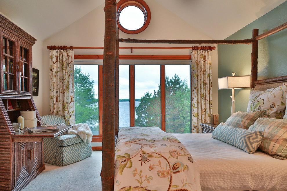 Inspiration for a mid-sized rustic master carpeted bedroom remodel with blue walls and no fireplace