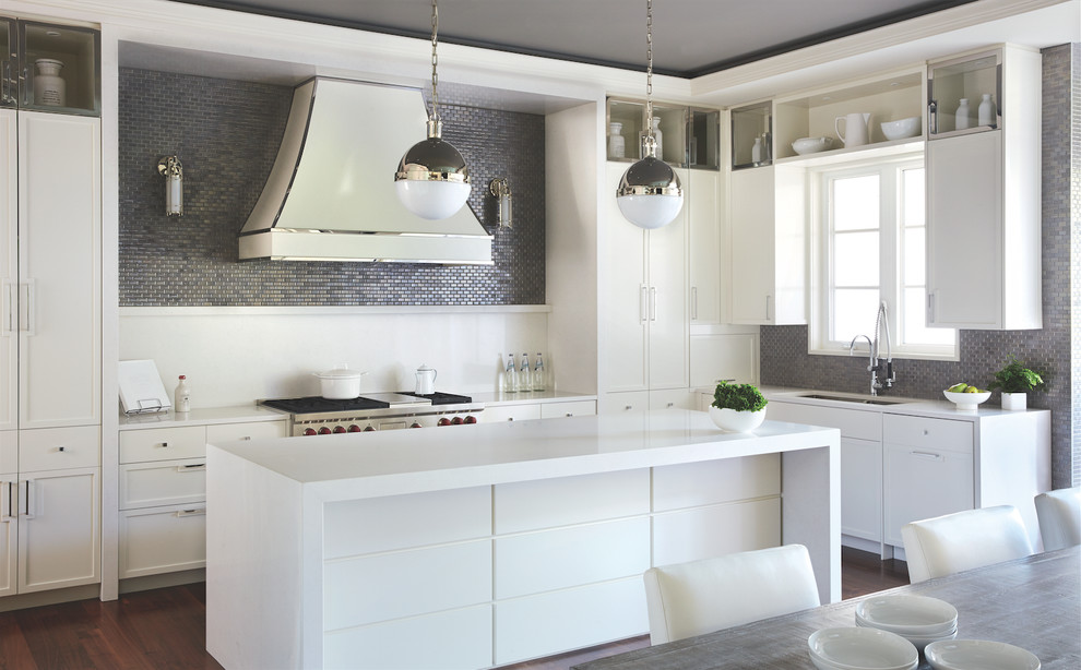 Inspiration for a contemporary l-shaped eat-in kitchen in Toronto with an undermount sink, flat-panel cabinets, white cabinets, grey splashback, mosaic tile splashback, stainless steel appliances, dark hardwood floors and with island.