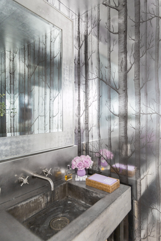 Inspiration for a contemporary powder room in Houston with grey walls, an integrated sink and concrete benchtops.