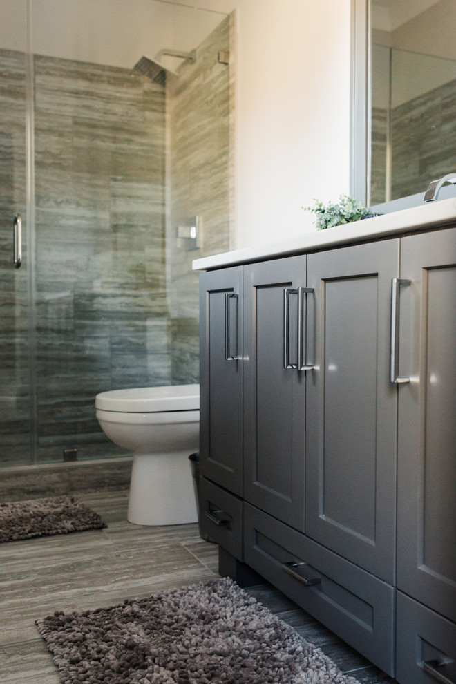 Contemporary bathroom in Charleston with shaker cabinets and grey cabinets.