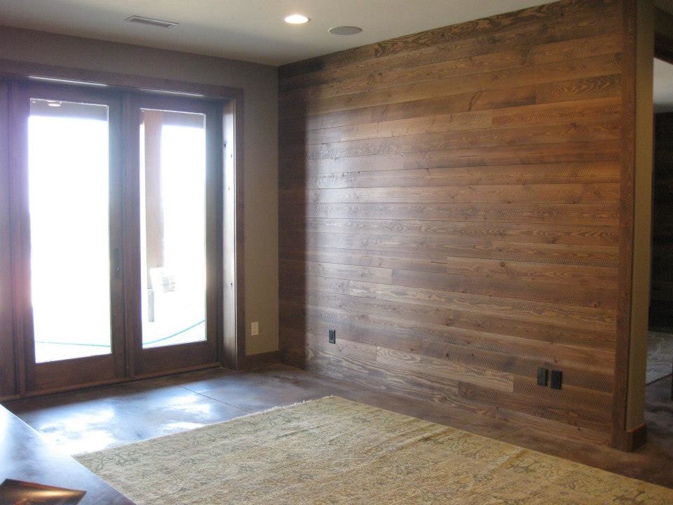 Large mountain style mudroom photo with a medium wood front door