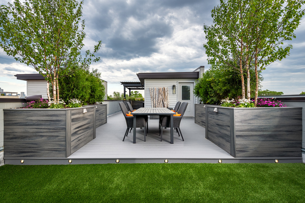Design ideas for an expansive modern rooftop deck in Chicago with a container garden and a pergola.