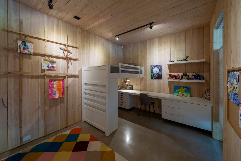435W and 104N Adams - Example of a bedroom and large minimalist gender-neutral concrete floor, gray floor, wood ceiling and wall paneling kids' bedroom design in Dallas with brown walls