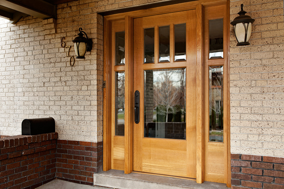 Design ideas for a mid-sized traditional front door in Denver with a single front door, a light wood front door and beige walls.