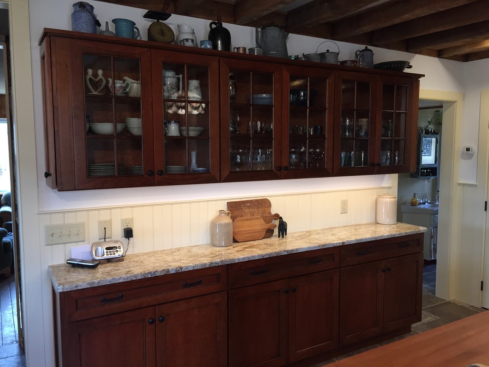 Inspiration for a mid-sized country u-shaped separate kitchen in Other with an undermount sink, recessed-panel cabinets, medium wood cabinets, granite benchtops, beige splashback, stainless steel appliances, ceramic floors, with island, brown floor and beige benchtop.