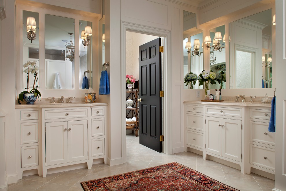Large traditional bathroom in Philadelphia with beaded inset cabinets, white cabinets and beige tile.