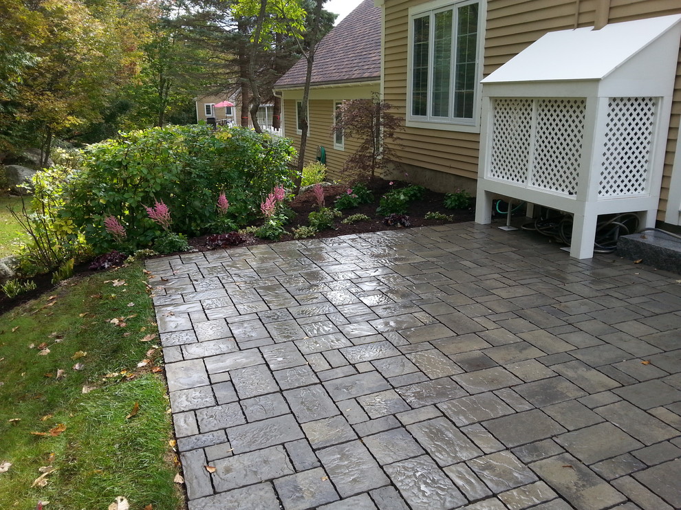 Inspiration for a small traditional backyard patio in Boston with concrete pavers and no cover.