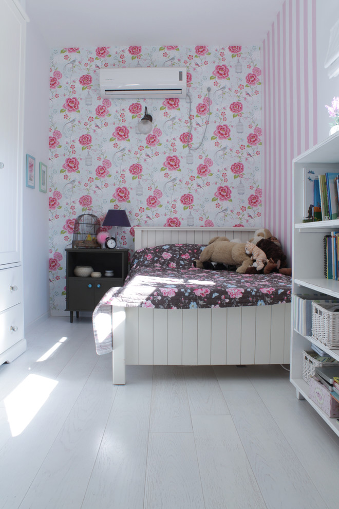 Eclectic kids' bedroom in Tel Aviv with painted wood floors, white floor and multi-coloured walls for girls.