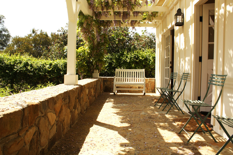 This is an example of a country verandah in Santa Barbara with a pergola.