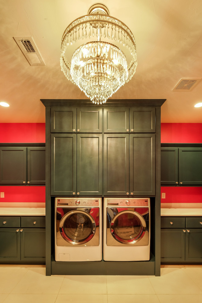 This is an example of an expansive country u-shaped dedicated laundry room in Denver with recessed-panel cabinets, green cabinets, quartzite benchtops, pink walls, ceramic floors and a side-by-side washer and dryer.
