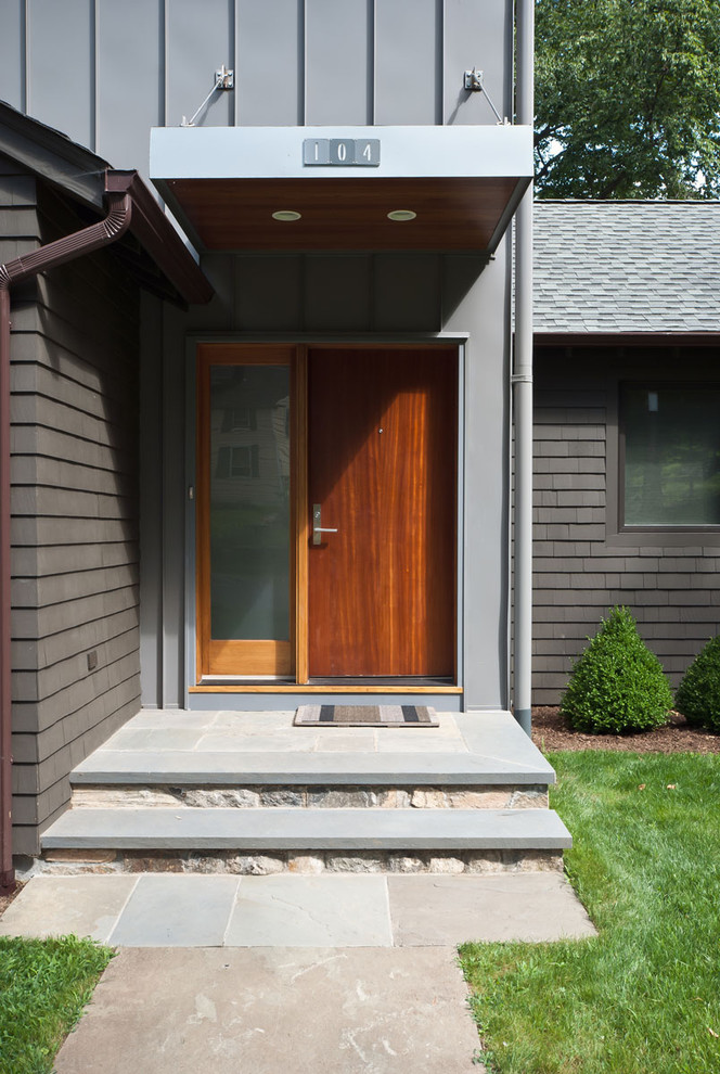 Inspiration for a contemporary front door in New York with a single front door.