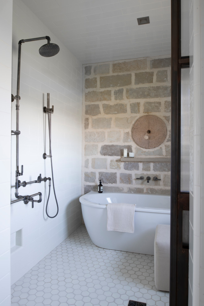 Inspiration for a rustic bathroom in Minneapolis with stone tiles.