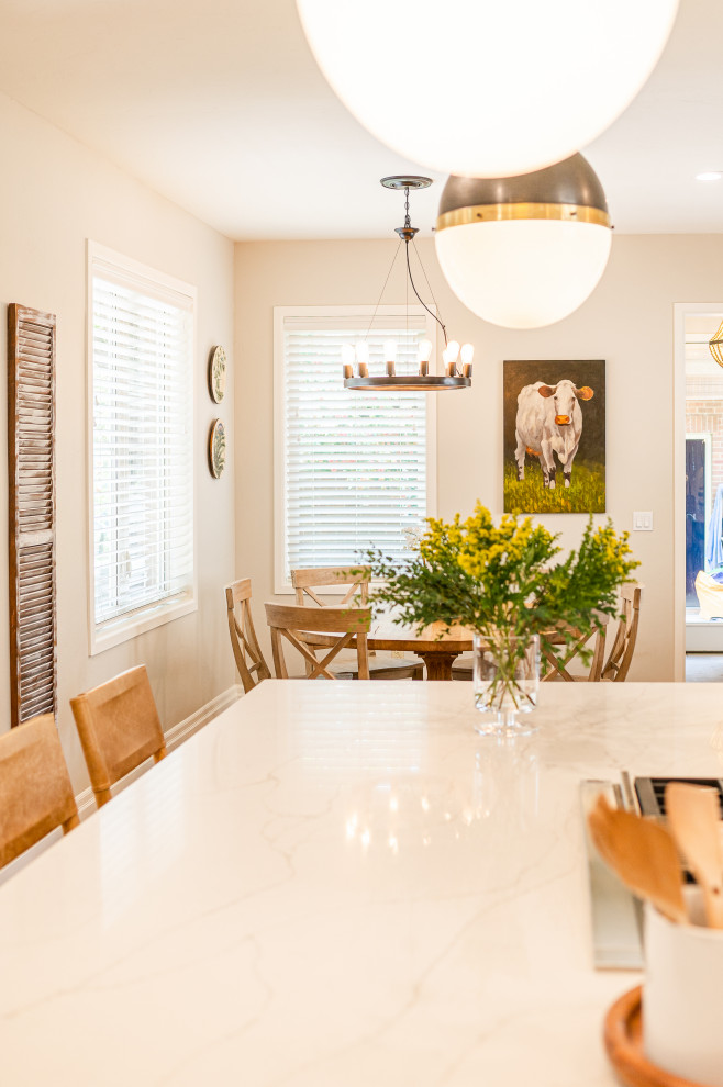Large transitional l-shaped dark wood floor and brown floor open concept kitchen photo in Denver with a farmhouse sink, shaker cabinets, beige cabinets, quartz countertops, beige backsplash, ceramic backsplash, stainless steel appliances, an island and white countertops