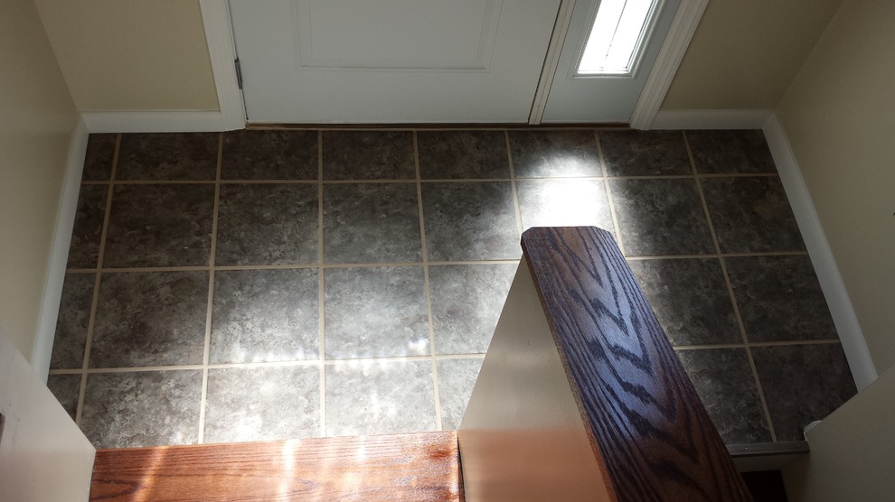Trendy ceramic tile foyer photo