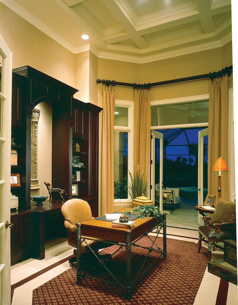 Inspiration for a large mediterranean study room in Miami with beige walls, carpet, no fireplace and a freestanding desk.