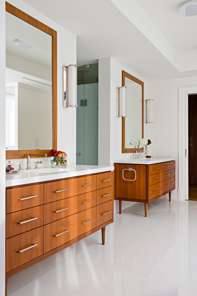 Inspiration for a large contemporary 3/4 bathroom in Toronto with flat-panel cabinets, brown cabinets, a freestanding tub, an alcove shower, multi-coloured tile, stone slab, white walls, marble floors, an undermount sink, quartzite benchtops, white floor, a hinged shower door, white benchtops, an enclosed toilet, a double vanity, a built-in vanity, recessed and wood walls.