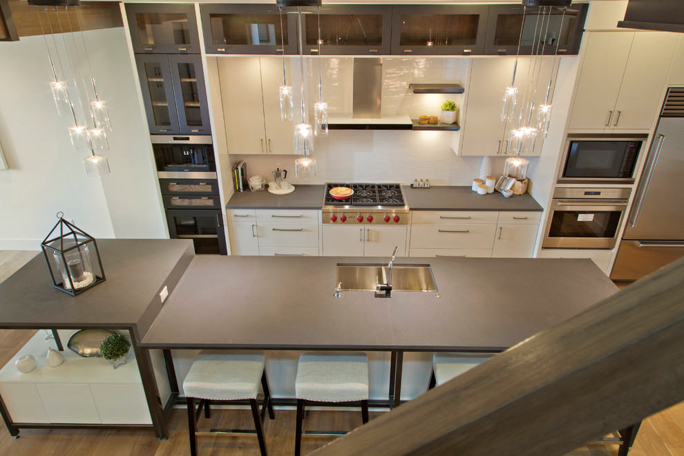 Example of a transitional kitchen design in Calgary