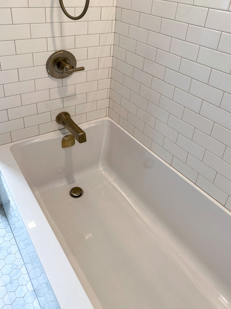 Design ideas for a transitional master bathroom in Boston with shaker cabinets, grey cabinets, an alcove tub, a shower/bathtub combo, a bidet, white tile, subway tile, white walls, porcelain floors, an undermount sink, engineered quartz benchtops, grey floor, a shower curtain, grey benchtops, a double vanity and a built-in vanity.