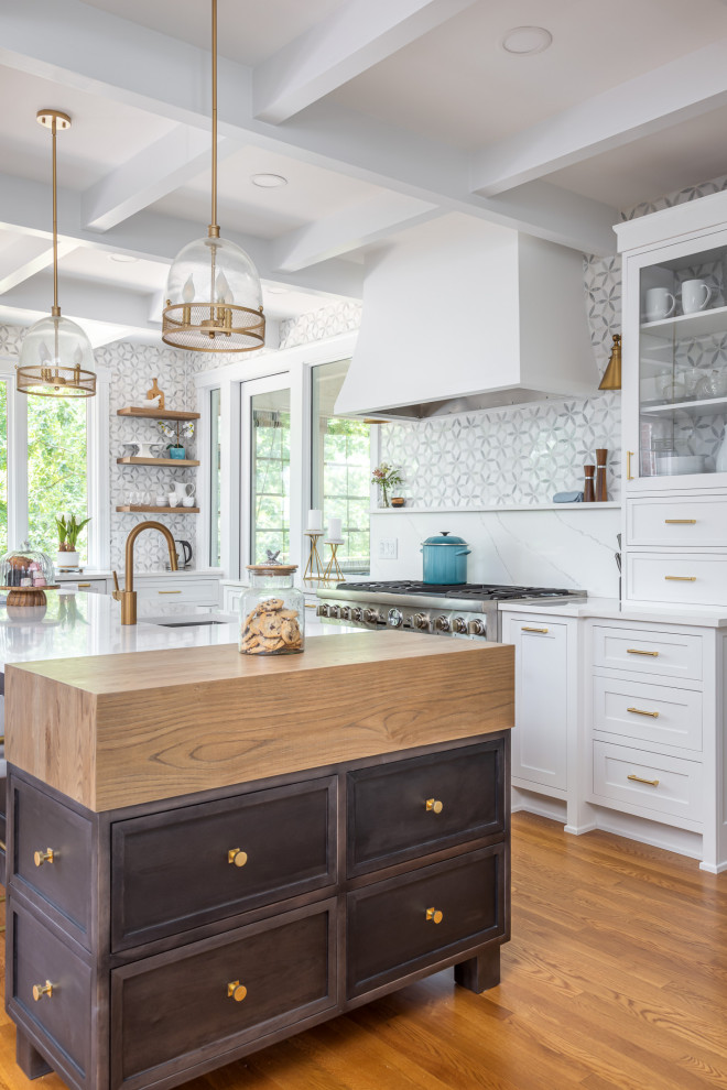 Design ideas for a mid-sized traditional single-wall open plan kitchen in Raleigh with an undermount sink, shaker cabinets, white cabinets, quartzite benchtops, grey splashback, marble splashback, stainless steel appliances, medium hardwood floors, with island, brown floor, white benchtop and exposed beam.