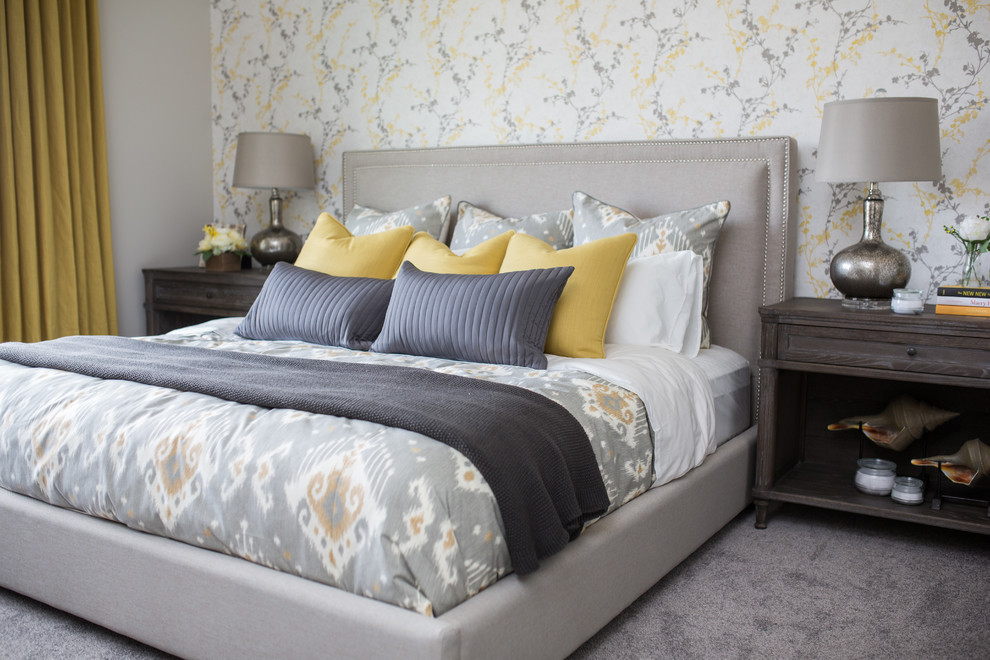 Example of a mid-sized transitional master carpeted bedroom design in Calgary with no fireplace and multicolored walls