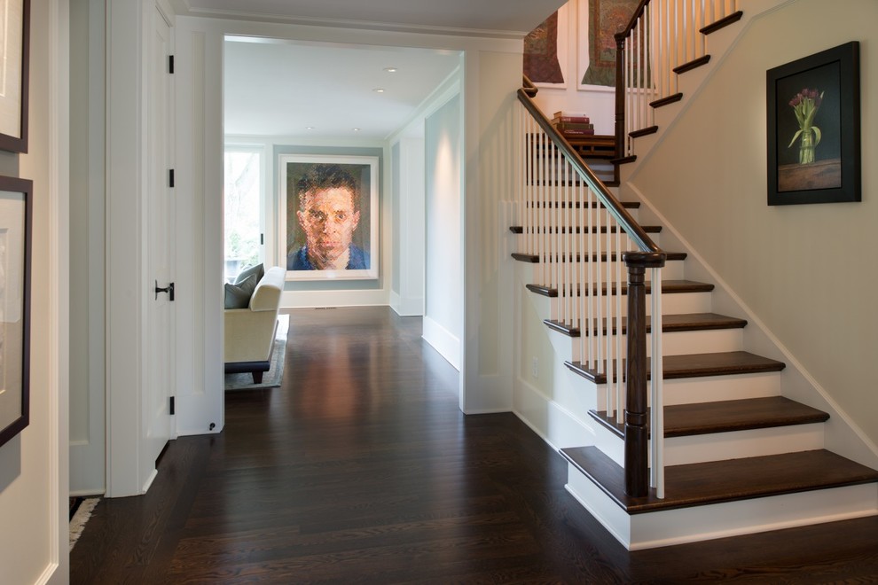 Mid-sized transitional wooden l-shaped dark wood floor staircase photo in Minneapolis with white walls and painted risers