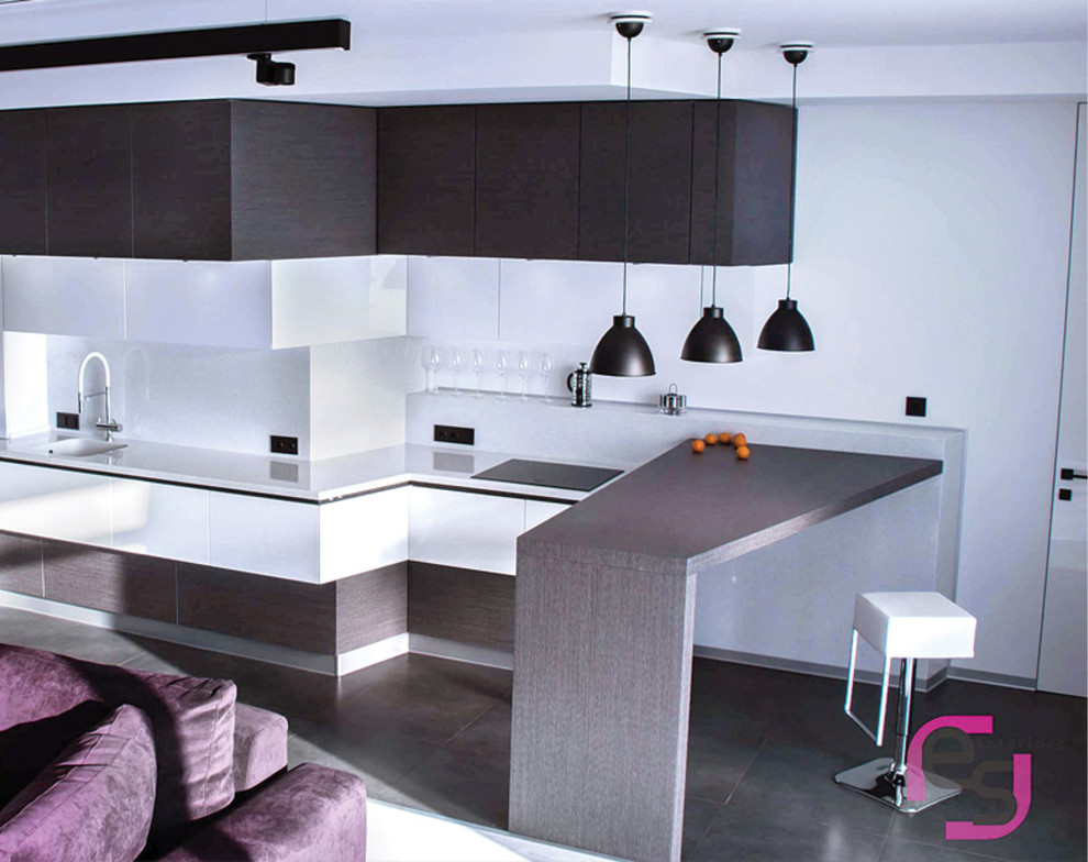 Large contemporary l-shaped open plan kitchen in Moscow with flat-panel cabinets, grey cabinets, solid surface benchtops, white splashback, white benchtop, an integrated sink, white appliances, porcelain floors and grey floor.