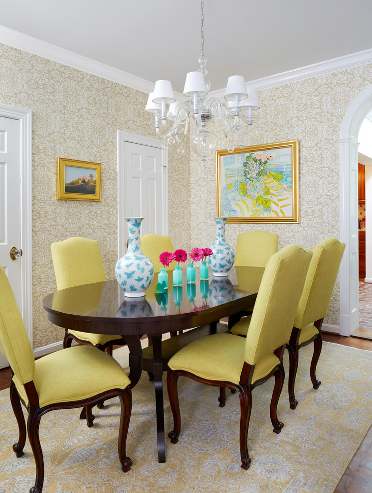 Example of a cottage medium tone wood floor and brown floor enclosed dining room design in DC Metro with beige walls