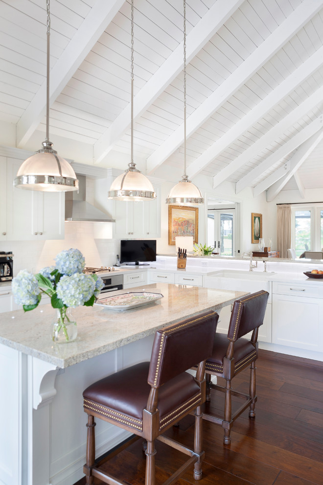 Mid-sized transitional l-shaped dark wood floor and brown floor eat-in kitchen photo in Miami with dark wood cabinets, stainless steel appliances, a drop-in sink, recessed-panel cabinets, marble countertops, white backsplash, porcelain backsplash, an island and beige countertops