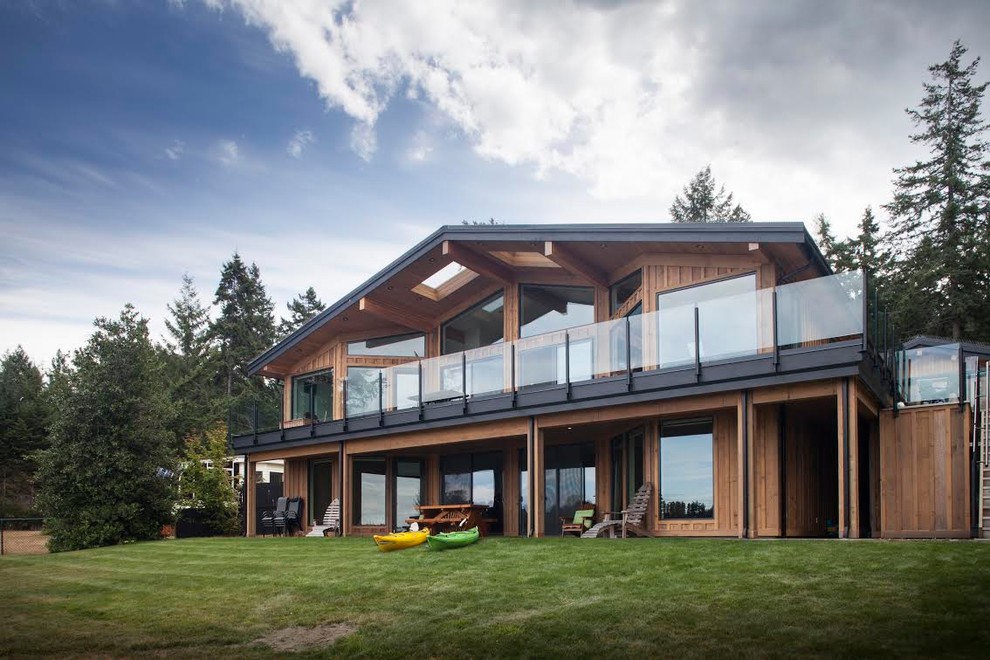 Mid-sized rustic brown two-story wood gable roof idea