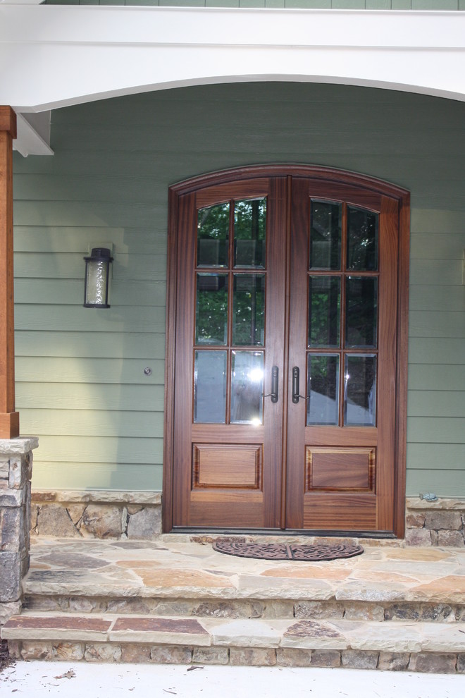 Design ideas for a mid-sized traditional front door in Atlanta with a double front door and a dark wood front door.