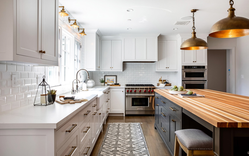 Inspiration for a mid-sized country l-shaped separate kitchen in Los Angeles with an undermount sink, shaker cabinets, beige cabinets, quartz benchtops, stainless steel appliances, medium hardwood floors and with island.