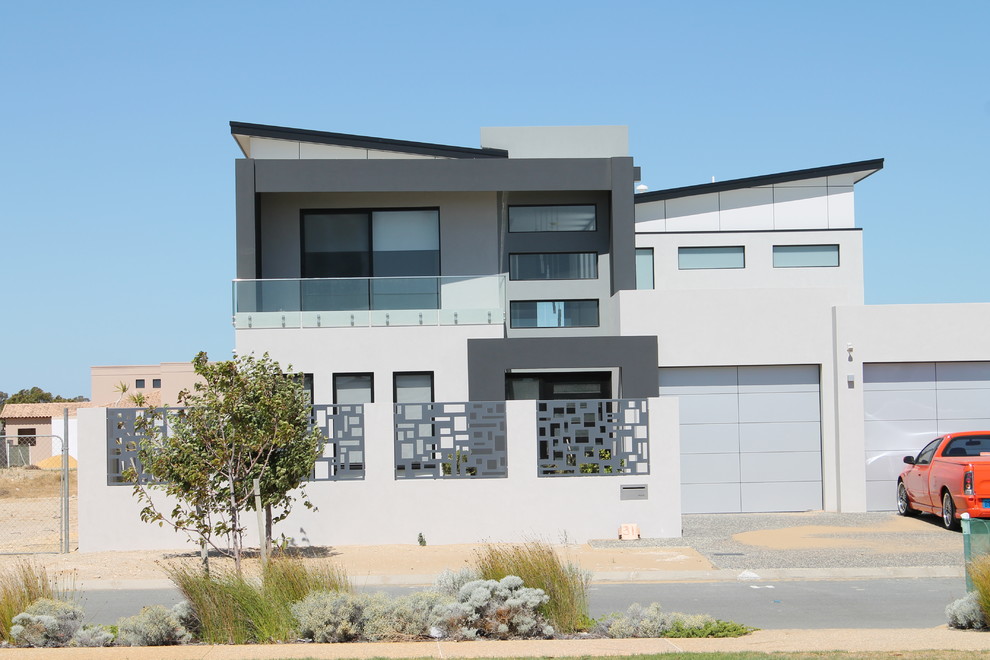 This is an example of a large modern two-storey grey exterior in Perth.