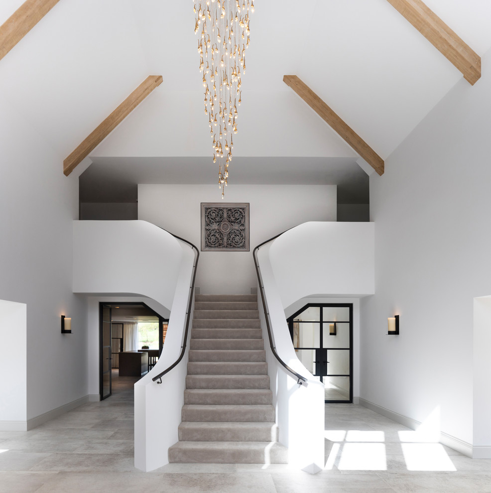 Design ideas for an expansive transitional staircase in Cheshire.